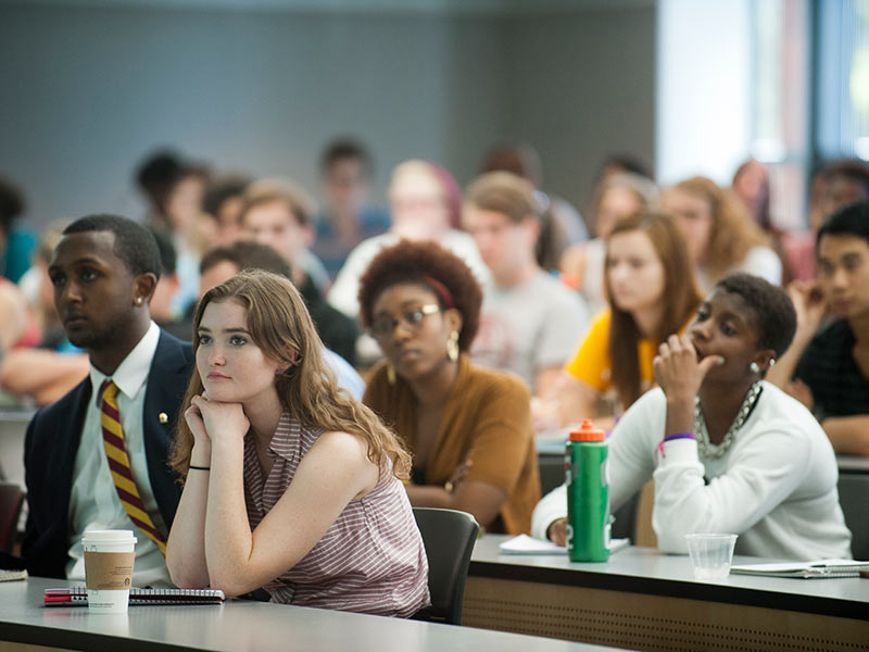 Students looking curious and attentive during a lecture.