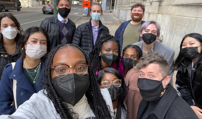 alix bryan-campos and a v.c.u. student group posing on a street near the virginia state capitol