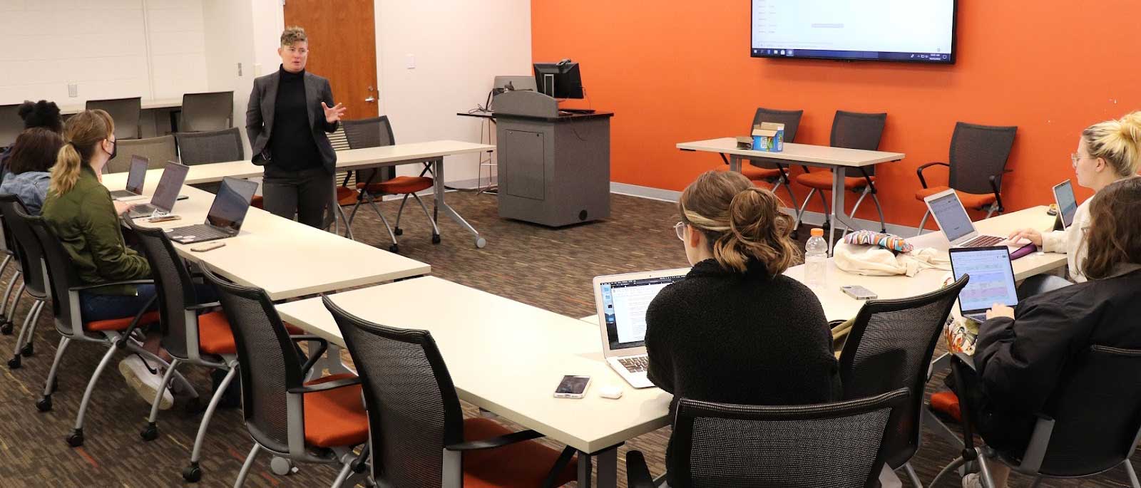 alix bryan-campos teaching a small group of students in a classroom