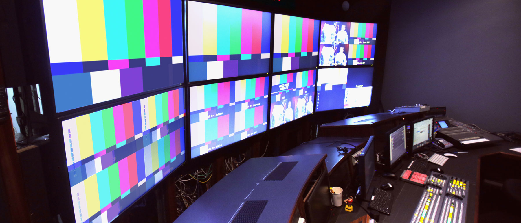 television production room with multiple t.v. screens and equipment